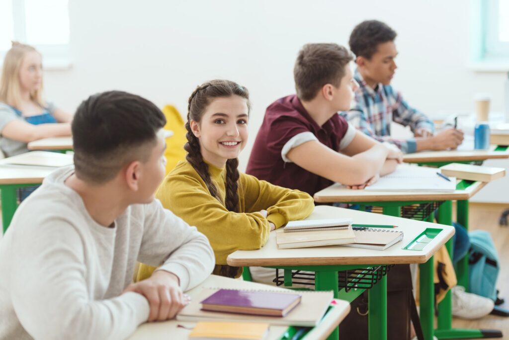 row of high school students sitting in class during lesson