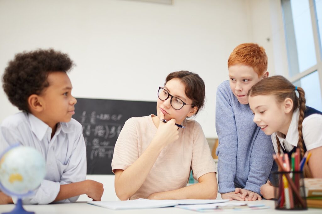 Teacher working with group of students